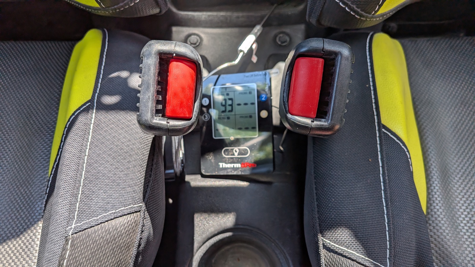 ThermoPro TP25 controller wedged between the RZR&rsquo;s rear seats, probe cable running forward