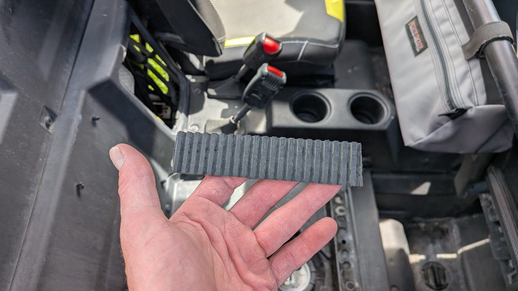 Broken CVT belt fragment over the RZR center console